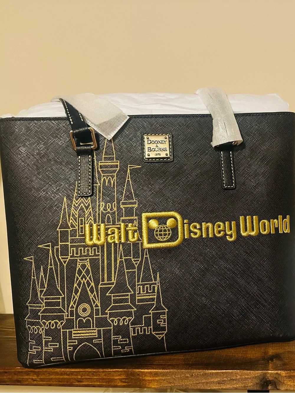 Dooney & Bourke Black Tote with Gold Castle Motif